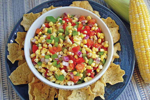 fresh corn salsa in bowl with tortilla chips