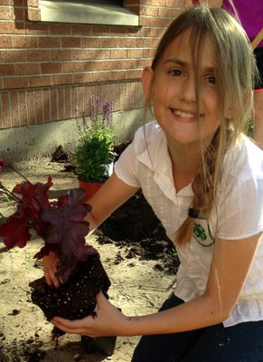Girl planting perennial