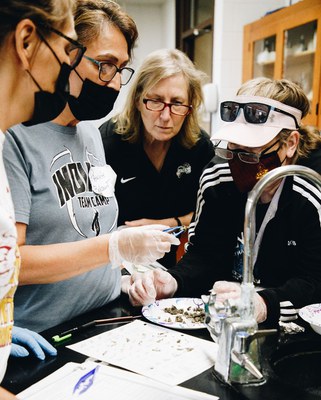 Angie Bartholomay instructing how to dissect Owl Pellets