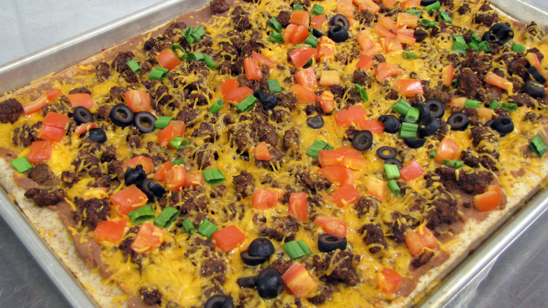 This easy taco pizza recipe can be topped with produce from your garden later this season. (NDSU Photo)