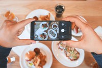 Using your phone while cooking or eating may create opportunities for viruses and bacteria to spread. (Photo by Eaters Collective on Unsplash)