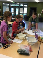 Youth learn cooking skills at the North Dakota 4-H Camp. (NDSU photo)