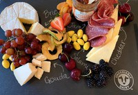 A cheese board has a range of cheese, meat, vegetables, fruits and grain items on the side. (Photo courtesy of Midwest Dairy)