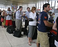 Long lines at the airport can cause stress that affects your eating patterns.