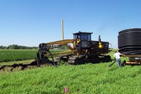 Feeding the tile to the plough