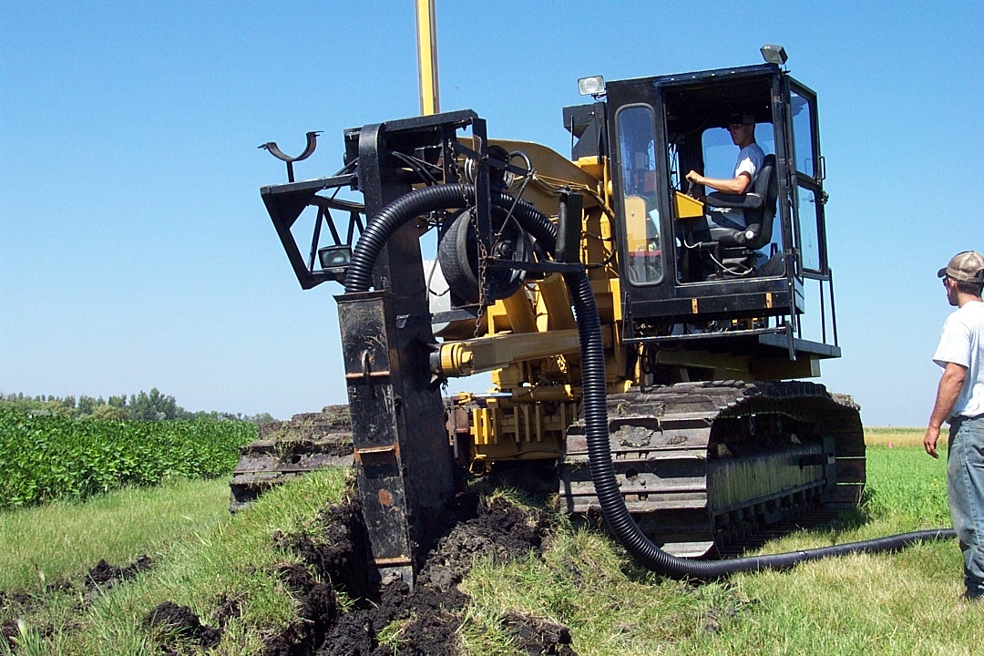 Tile plough installing tile