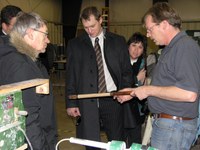 Jim Stadum, co-owner of Samsara Cues in Rugby, shows RLND members how his company makes pool cues. The class members are (from left) Lowell Disrud of Fargo, Jon Scraper of Fargo (behind Disrud), Kevin Hall of Hoople and April Jepson of Killdeer.