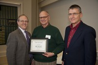 D.C. Coston (left), NDSU vice president for Agriculture and University Extension, presents the Eugene R. Dahl Excellence in Research Award to Dale Herman (center), a professor in the Plant Sciences Department. Brian Dahl, right, is a sponsor of the award.