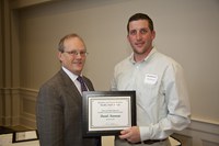 D.C. Coston, NDSU vice president for Agriculture and University Extension (left), presents the Myron and Muriel Johnsrud Excellence in Extension/Outreach Award to David Newman, Extension swine specialist in the Animal Sciences Department.
