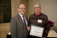 D.C. Coston, NDSU vice president for Agriculture and University Extension (left), presents the Charles and Linda Moses Staff Award to Norman Cattanach, a research specialist in the School of Natural Resource Sciences (Soil Science).