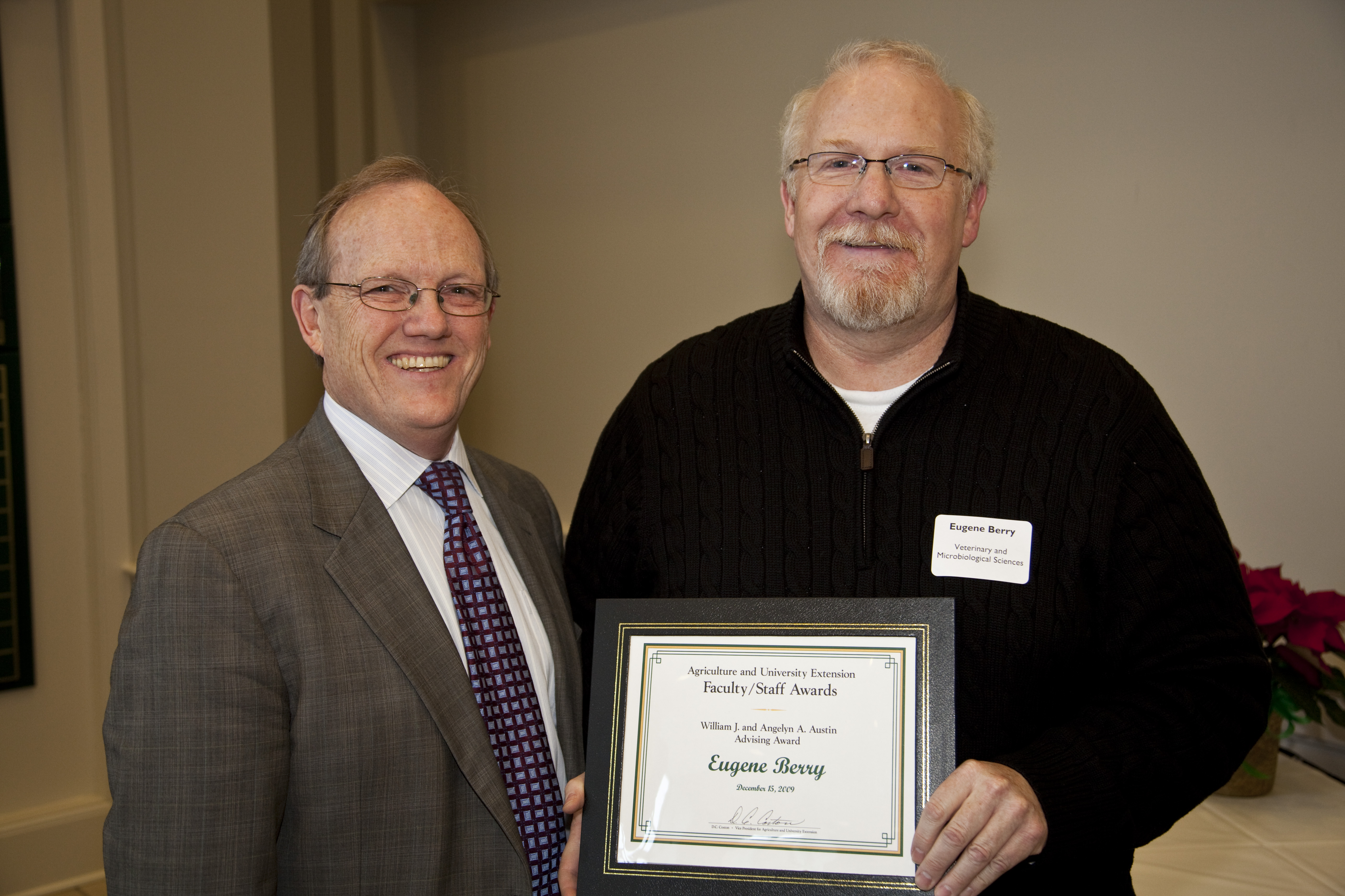 NDSU Vice President for Agriculture and University Extension D.C. Coston, left, presents the William J. and Angelyn A. Austin Advising Award to Eugene Berry, an associate professor in the Veterinary and Microbiological Sciences Department.