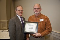 NDSU Vice President for Agriculture and University Extension D.C. Coston (left) presents the AGSCO Excellence in Extension Award to Dwight Aakre, Extension farm management specialist in the Agribusiness and Applied Economics Department.