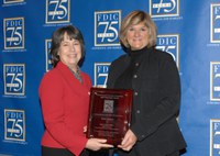 NDSU Extension Service family economics specialist Debra Pankow, right, receives the Chairman's Award for Innovation in Financial Education from Sheila Bair, FDIC chairwoman.