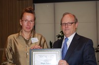 Birgit Pruess, an assistant professor in the Veterinary and Microbiological Sciences Department, receives the William J. and Angelyn A. Austin Advising Award from D.C. Coston, NDSU vice president for Agriculture and University Extension.