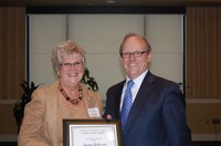 D.C. Coston, NDSU vice president for Agriculture and University Extension, presents Norma Ackerson, information processing specialist in the Agribusiness and Applied Economics Department, the Donald and Jo Anderson Staff Award.