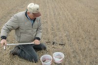 Williams County Extension agent Warren Froelich takes a soil sample.