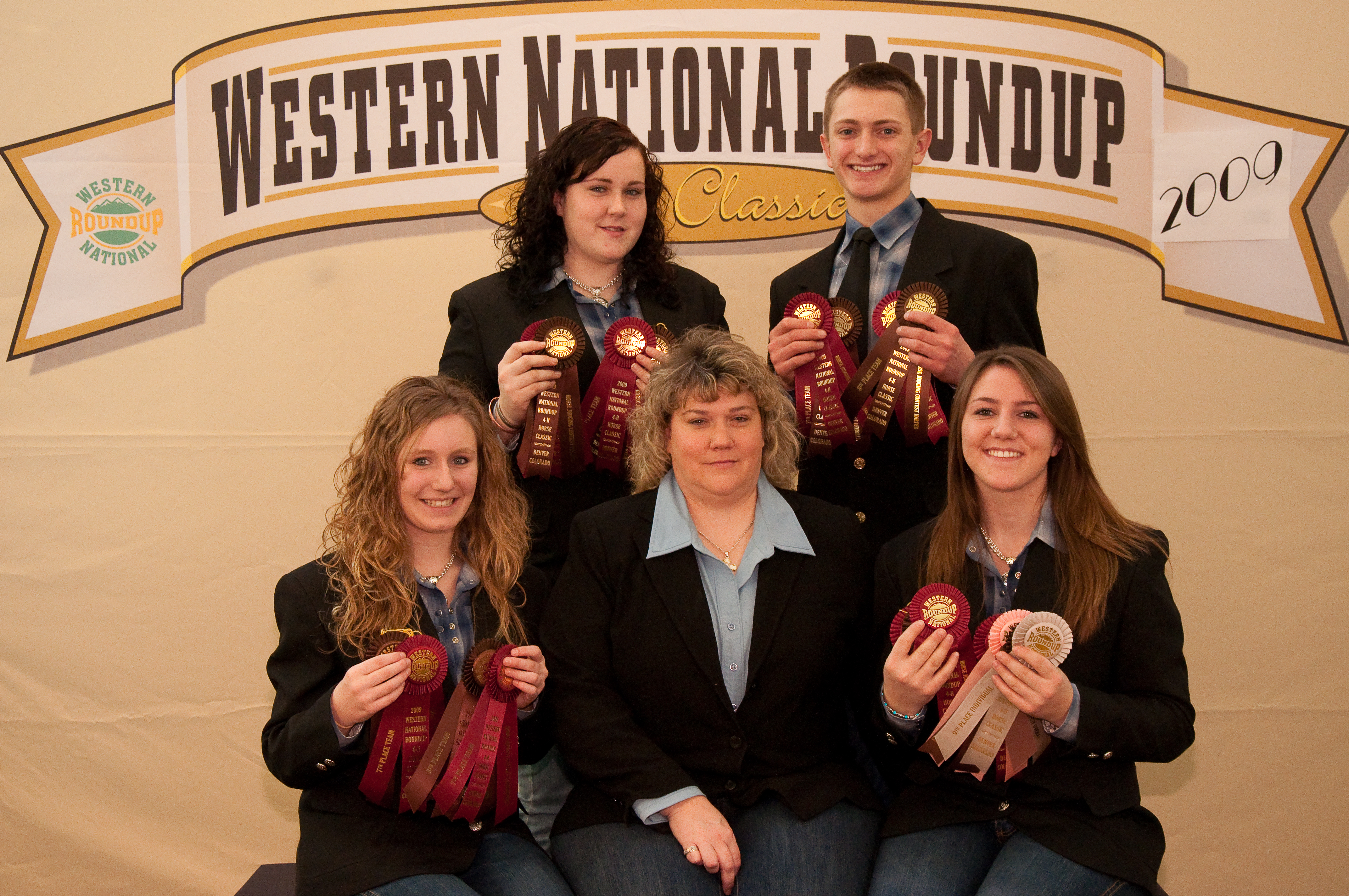 The Burleigh County horse judging team displays the ribbons it won at the Western National Roundup in Denver. Pictured are (from left), front row: team member Kodi Lardy, coach Sheila Scholl and team member Abby Lengenfelder; back row: team members Caryn Scholl and Ross Stanley.