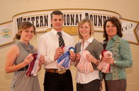 The Wells County hippology team displays the ribbons it won at the Western National Roundup in Denver. Pictured (from left) are: team members Chelsey Schafer, Cody Perbix and Anna Richter, and coach Leann Schafer.