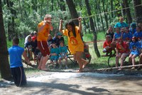 Youth take the Western 4-H Camp's Survivor Outdoor Recreation Camp mud-pit challenge.
