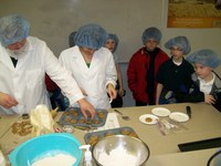 Students from Holy Spirit Elementary visit the class and get to taste the products.
