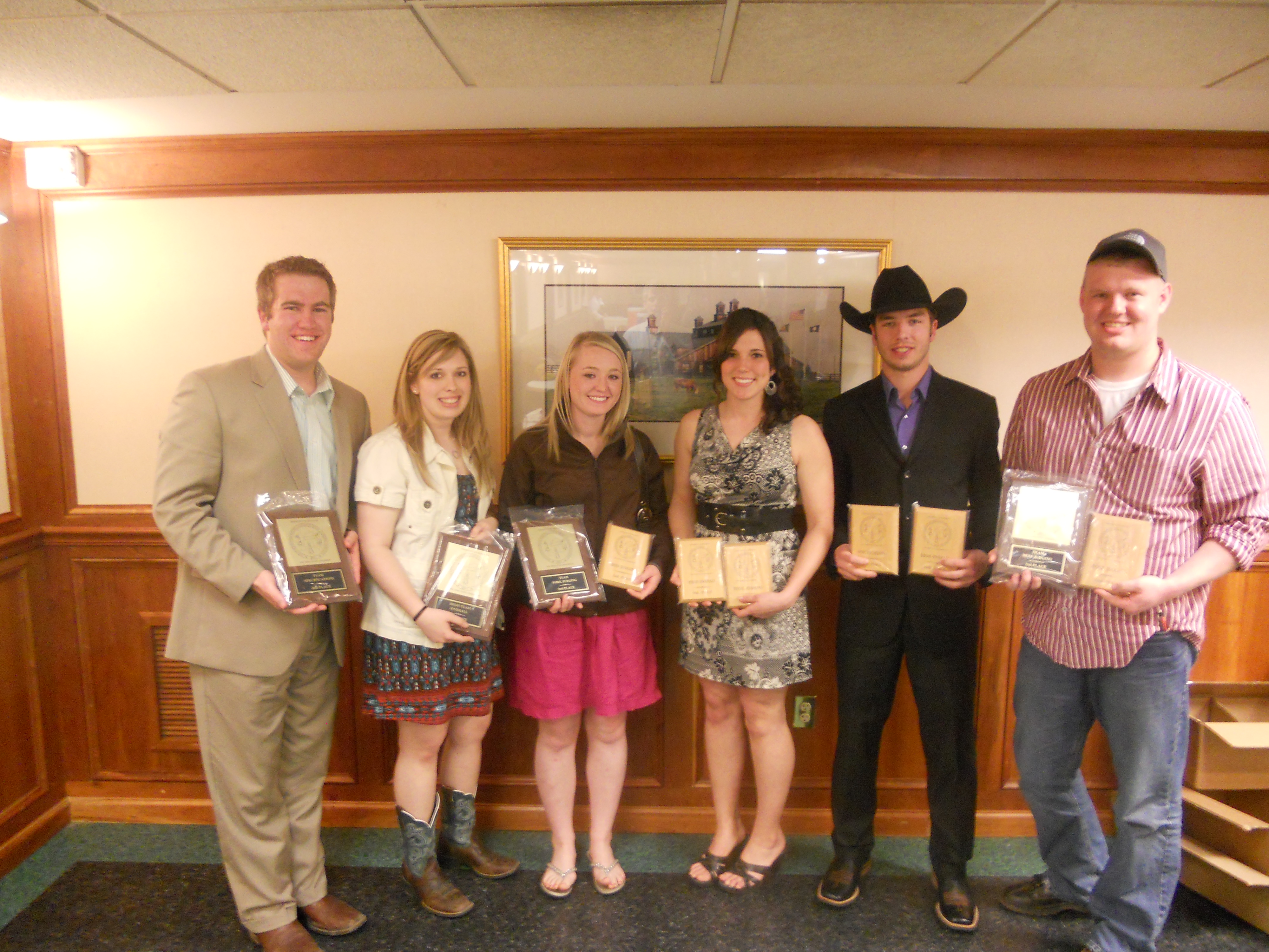 NDSU's meat judging team members display awards they received at the Southeastern Intercollegiate Meat Contest. Pictured are, from left to right: team member Levi Hall; coach Kelsey Phelps; team members Micayla Clarin, Christine Wanner and Mason Lautenschlager; and coach Nathan Hayes.