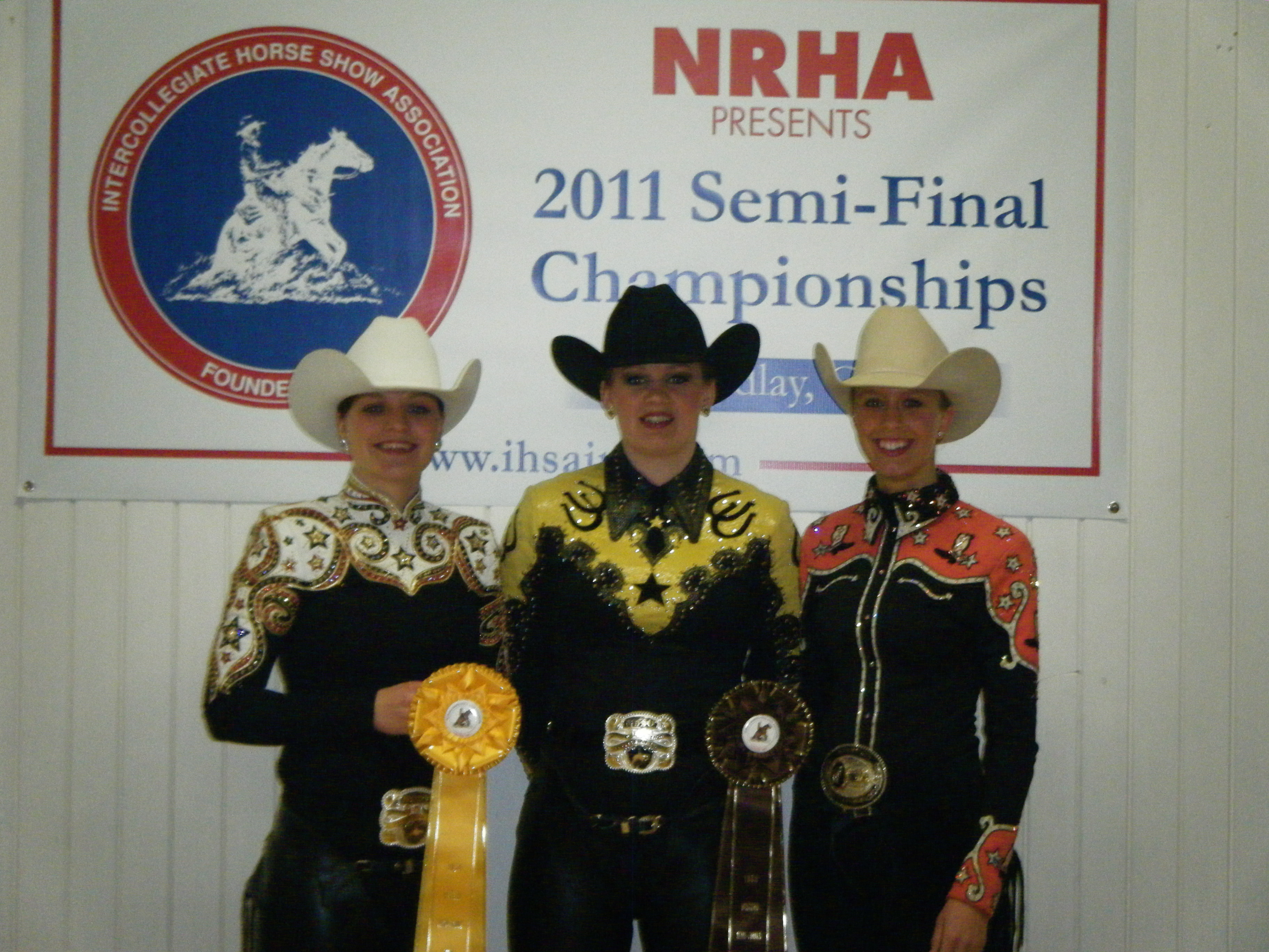 Three members of NDSU's equestrian team display the ribbons they received at the Intercollegiate Horse Show Association's semifinal show in Findlay, Ohio. They are, from left to right: Shannon Voges, Juliann Zach and Kelly O'Connell.