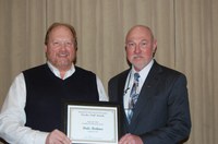 Dale Redmer (left) receives the Eugene R. Dahl Excellence in Research Award from Ken Grafton, vice president for Agriculture and University Extension.
