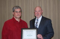 Kirk Howatt (left) receives the William J. and Angelyn A. Austin Advising Award from Ken Grafton, vice president for Agriculture and University Extension.