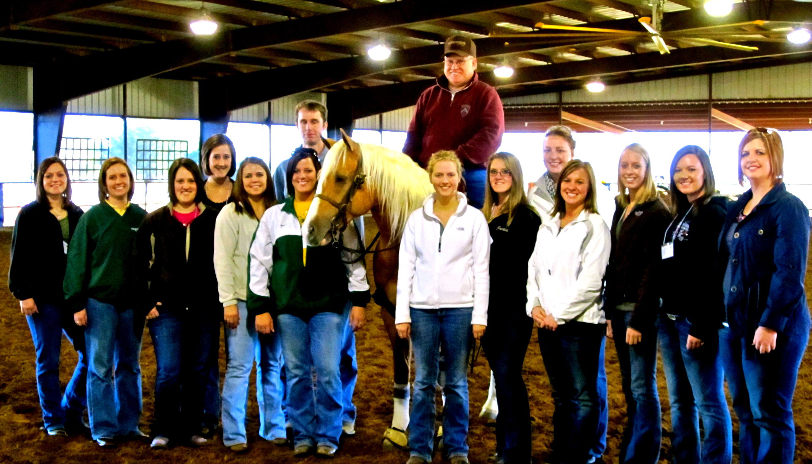 NDSU's Collegiate Horsemen's Association visits McQuay Stables during the American Collegiate Horsemen's Association convention in Fort Worth, Texas. Pictured are (from left to right; all are club members unless otherwise noted) back row: Amanda Grev, David Anderson, stable owner Tim McQuay and Jenna Benjaminson; front row: Shannon Voges, adviser Carrie Hammer, Citty Cole, Brittany Huggins, Catie Vieths, Janessa Thompson, Jackie Eldredge, Janelle Lanoue, Kelly O'Connell, Codie Miller and adviser Tara Swanson.