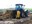 Anne Ehni, Wells County Soil Conservation District manager, demonstrates how to use a front-mounted composting windrow turner.