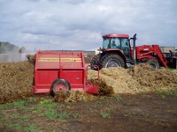 This implement is turning compost. A compost pile needs to be turned three to five times to get oxygen into the compost.