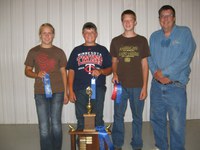 Walsh County's 4-H team placed first in the senior division of a land judging contest in Maddock. Pictured are (from left) team members Emily Zikmund, Tim Hodek and Josh Ruzicka, and coach Brad Brummond.