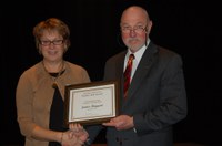 Janice Haggart receives the H. Roald and Janet Lund Excellence in Teaching Award from Ken Grafton