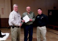 Nels (Rick) Olson (center) receives the Rick and Jody Burgum Staff Award from Tim Faller (left), Agricultural Experiment Station assistant director, and Chris Schauer (right), Hettinger REC director