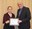 Cheryl Wachenheim, professor, Department of Agribusiness and Applied Economics, receives the William J. and Angelyn A. Austin Excellence in Advising Award from David Buchanan, associate dean for academic programs in the College of Agriculture, Food Systems, and Natural Resources.