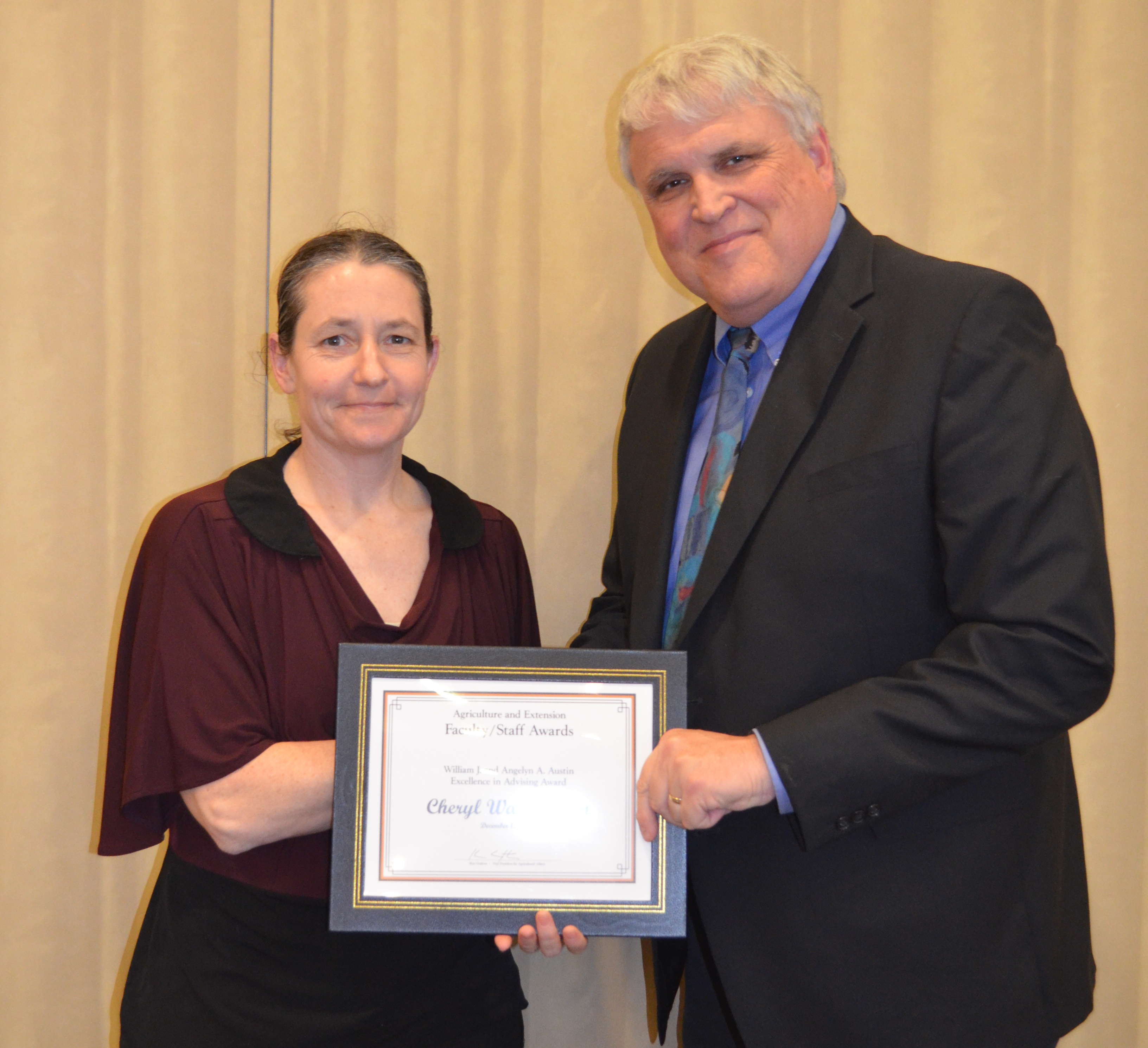 Cheryl Wachenheim, professor, Department of Agribusiness and Applied Economics, receives the William J. and Angelyn A. Austin Excellence in Advising Award from David Buchanan, associate dean for academic programs in the College of Agriculture, Food Systems, and Natural Resources.