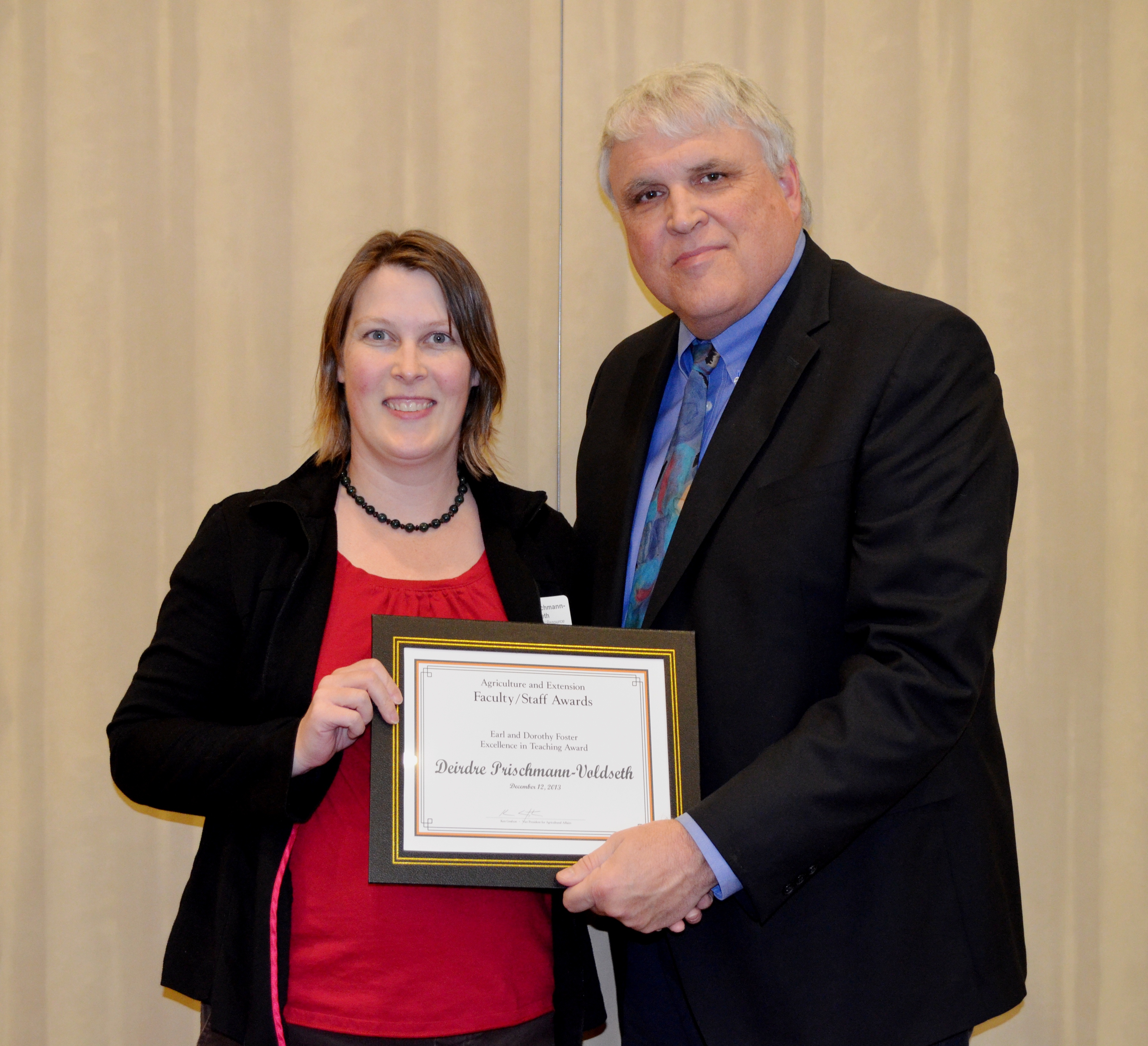 Deirdre Prischmann-Voldseth, assistant professor, School of Natural Resource Sciences (Entomology Department) receives the Earl and Dorothy Foster Excellence in Teaching Award from David Buchanan, associate dean for academic programs in the College of Agriculture, Food Systems, and Natural Resources.