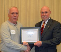 Jim Moos, maintenance mechanic, Department of Agricultural and Biosystems Engineering, left, receives the Rick and Jody Burgum Staff Award from Ken Grafton, vice president for Agricultural Affairs; dean of the College of Agriculture, Food Systems, and Natural Resources; and director of the North Dakota Agricultural Experiment Station.
