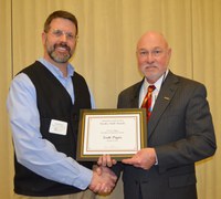 Scott Pryor, associate professor, Department of Agricultural and Biosystems Engineering, left, receives the Larson/Yaggie Excellence in Research Award from Ken Grafton, vice president for Agricultural Affairs; dean of the College of Agriculture, Food Systems, and Natural Resources; and director of the North Dakota Agricultural Experiment Station.
