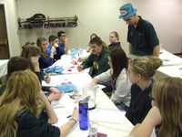 4-H’ers decide on a mock political party name, slogan and platform during the 2013 Citizenship in Action event in Bismarck.