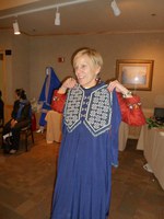 Project Artemis member shows off some of Zuhra's bead work on a dress