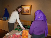 Zuhra displays some of her bead work during Project Artemis