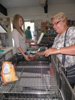 Vickie Paige of Mohall at the checkout counter