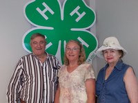 Ann Marks of Ypsilanti (center) receives the North Dakota 4-H Foundation's Outstanding Lifetime Volunteer Award in Minot. She is accompanied by her brother, Jim Swift of Carpio, and a friend, Nordell Cockrel of Minot.