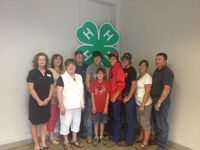 The Erickson family of Mercer County is named a 2012-13 4-H century family. Pictured are (from left), North Dakota 4-H Foundation President Maureen Ming, Leann Erickson Schafer and Judy, Leland, Tanner, Tucker, Trever, Tyler, Roberta and D.J. Erickson.