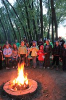 Youth gather around a campfire at the end of a fun-filled day at the North Dakota 4-H Camp near Washburn.
