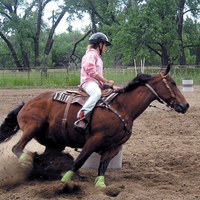A 4-H'er practices barrel riding during the Barrel and Pole Camp at the North Dakota 4-H Camp near Washburn.
