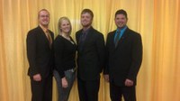 NDSU's dairy judging team returned from the All-American Dairy Show with several awards. Pictured are (from left) team members Eric Miller, Kristi Tonnessen and Brett Blackwelder, and team coach Cole Rupprecht. (NDSU photo)