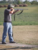 Jacob Ellingson of Morton County takes a shot during the 4-H Summer Shooting Sports State Match at the Capitol City gun range near Bismarck.