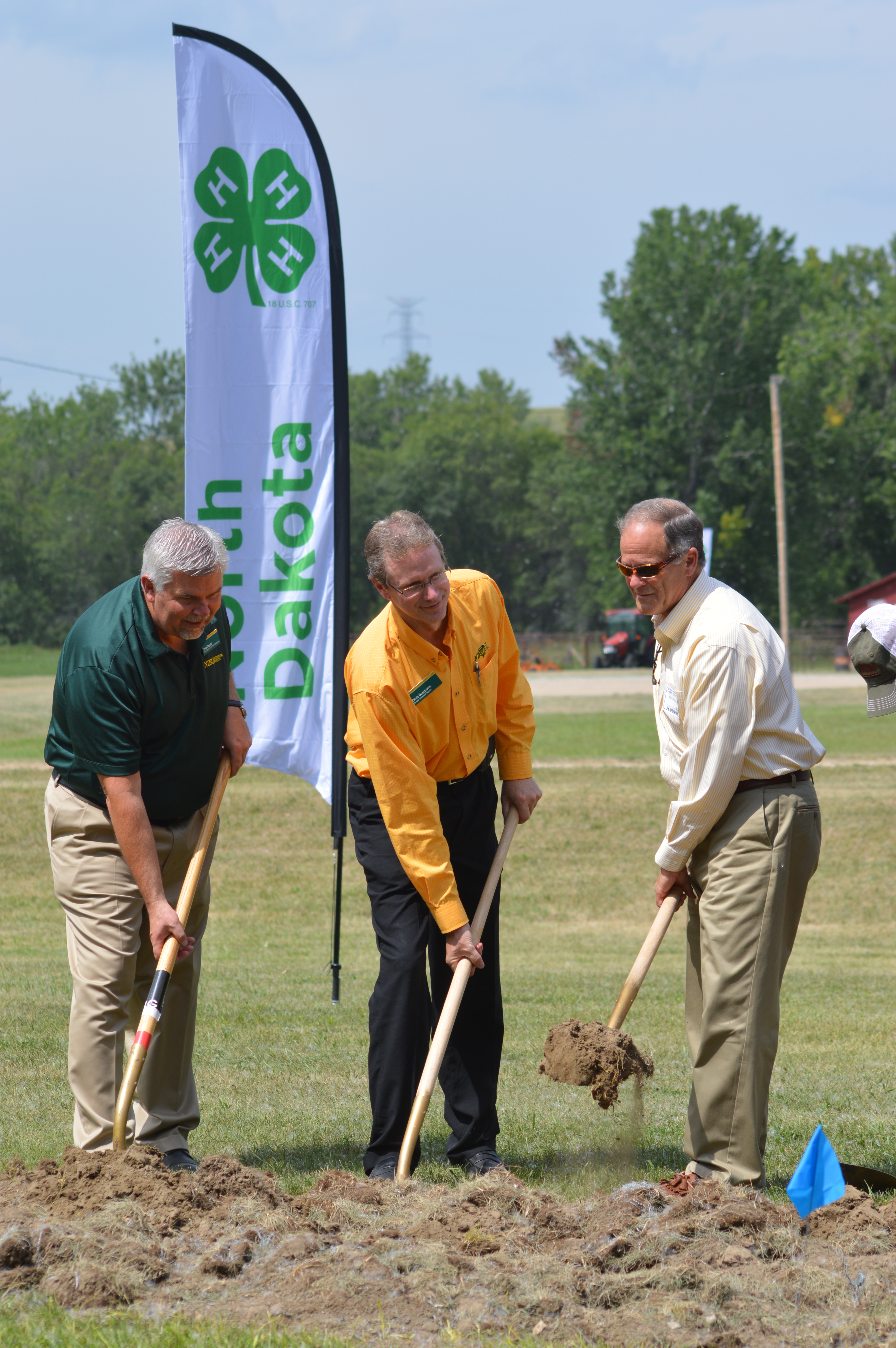 NDSU Extension Service Center for 4-H Youth Development Chair Brad Cogdill (left), NDSU Extension Service Director Chris Boerboom and NDSU President Dean Bresciani help break ground for a multipurpose facility at the North Dakota 4-H Camp near Washburn. The facility is part of a $2.3 million renovation project at the 47-year-old camp. (NDSU photo)
